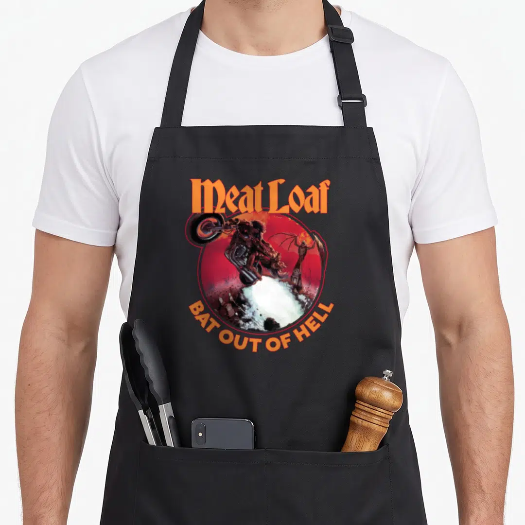 Bat hell meat aprons - Meat Loaf text above circular demon on motorcycle image with curved title below — shown on a black cotton canvas apron against a white background