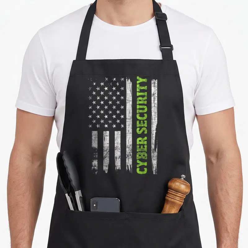 Flag engineer apron - Distressed USA flag with vertical lime green CYBER SECURITY text on black background — shown on a black cotton canvas apron against a white background