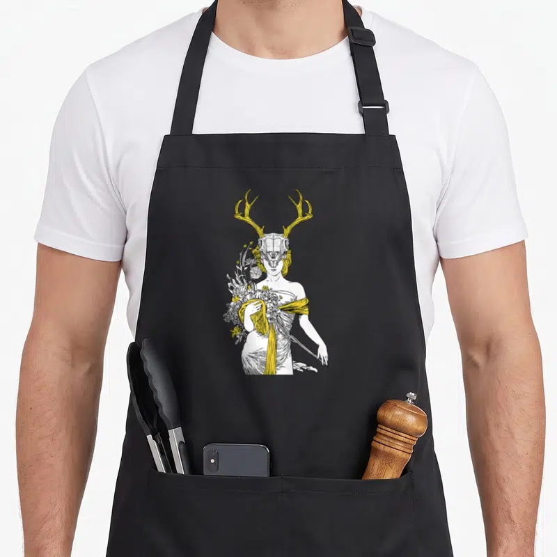 Village witch apron - Line art of person with deer skull, yellow antlers, and flower cluster — shown on a black cotton canvas apron against a white background