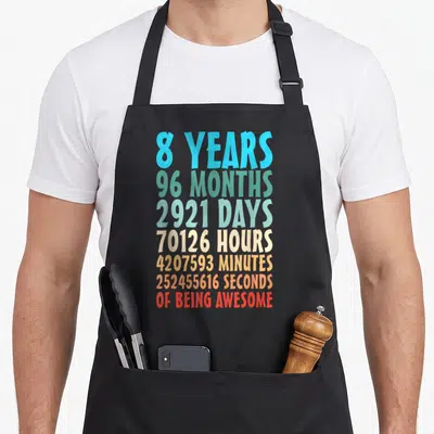 Month 8th birthday apron - Stacked colorful text reading 8 years 96 months 2921 days 70126 hours 4207593 minutes — shown on a black cotton canvas apron against a white background