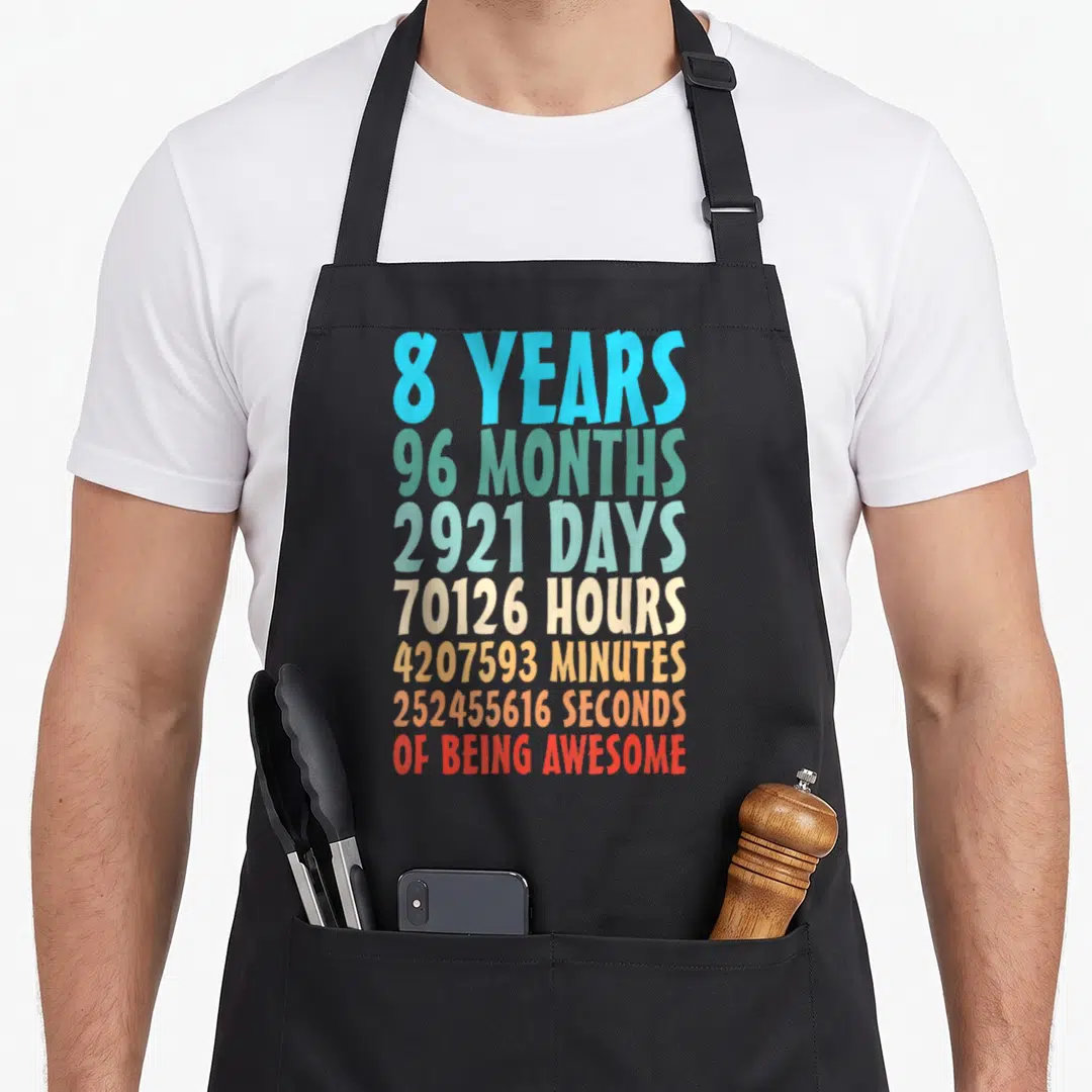 Month 8th birthday apron - Stacked colorful text reading 8 years 96 months 2921 days 70126 hours 4207593 minutes — shown on a black cotton canvas apron against a white background