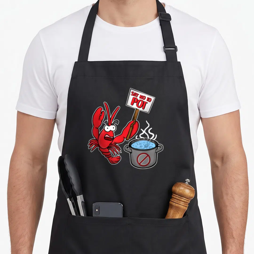 Funny pot lobster apron - Angry red cartoon lobster holding SAY NO TO POT sign next to steaming grey pot with blue — shown on a black cotton canvas apron against a white background