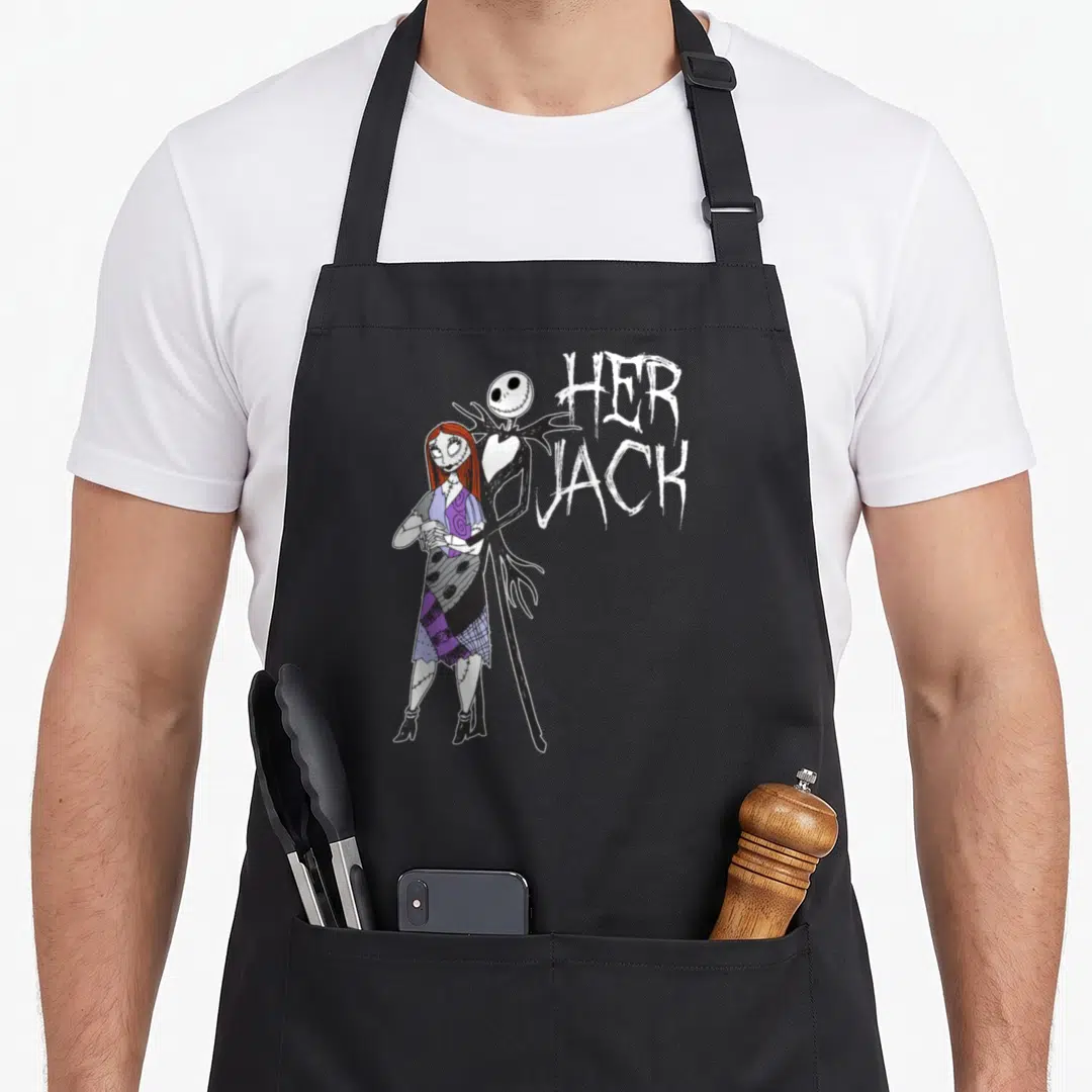 Cute jack apron - Jack Skellington and Sally standing together next to stacked HER JACK text in cartoon style — shown on a black cotton canvas apron against a white background
