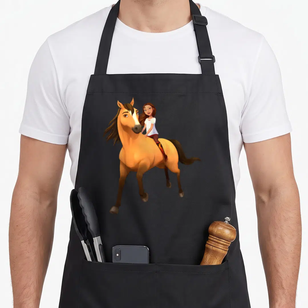 Lucky novelty apron - Cartoon girl riding a tan horse with brown mane and white facial blaze — shown on a black cotton canvas apron against a white background