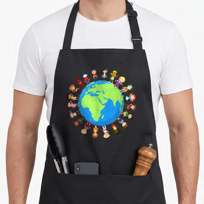 Around earth apron - Cartoon children standing in a circle around a blue and green globe with yellow and red clothing — shown on a black cotton canvas apron against a white background