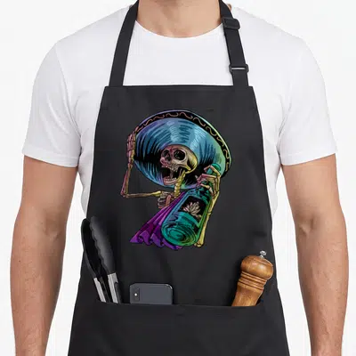 Bandito mexican apron - Cartoon skeleton in blue sombrero and purple poncho holding a teal bottle — shown on a black cotton canvas apron against a white background