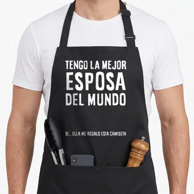 Esposo paratrooper apron - White stacked Spanish text reading TENGO LA MEJOR ESPOSA DEL MUNDO with small footer — shown on a black cotton canvas apron against a white background