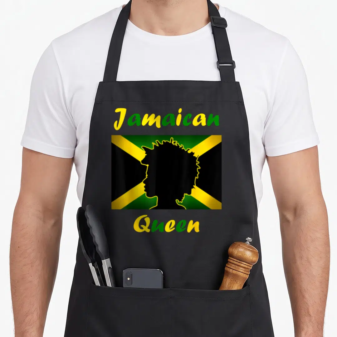 Jamaica queen apron - Jamaican Queen text over black female silhouette on green yellow and black flag — shown on a black cotton canvas apron against a white background