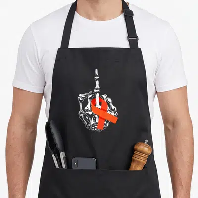 Leukemia cancer awareness apron - White skeleton hand middle finger gesture wrapped in red awareness ribbon line art — shown on a black cotton canvas apron against a white background