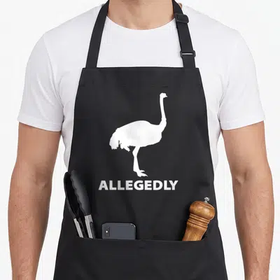 Retro allegedly bird apron - White ostrich silhouette standing above the word ALLEGEDLY — shown on a black cotton canvas apron against a white background