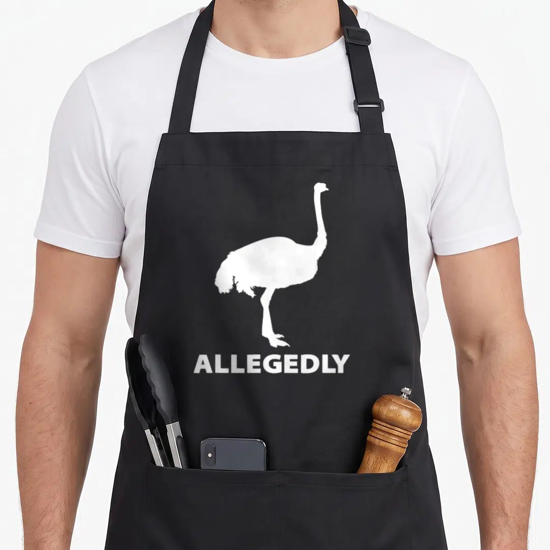 Retro allegedly bird apron - White ostrich silhouette standing above the word ALLEGEDLY — shown on a black cotton canvas apron against a white background