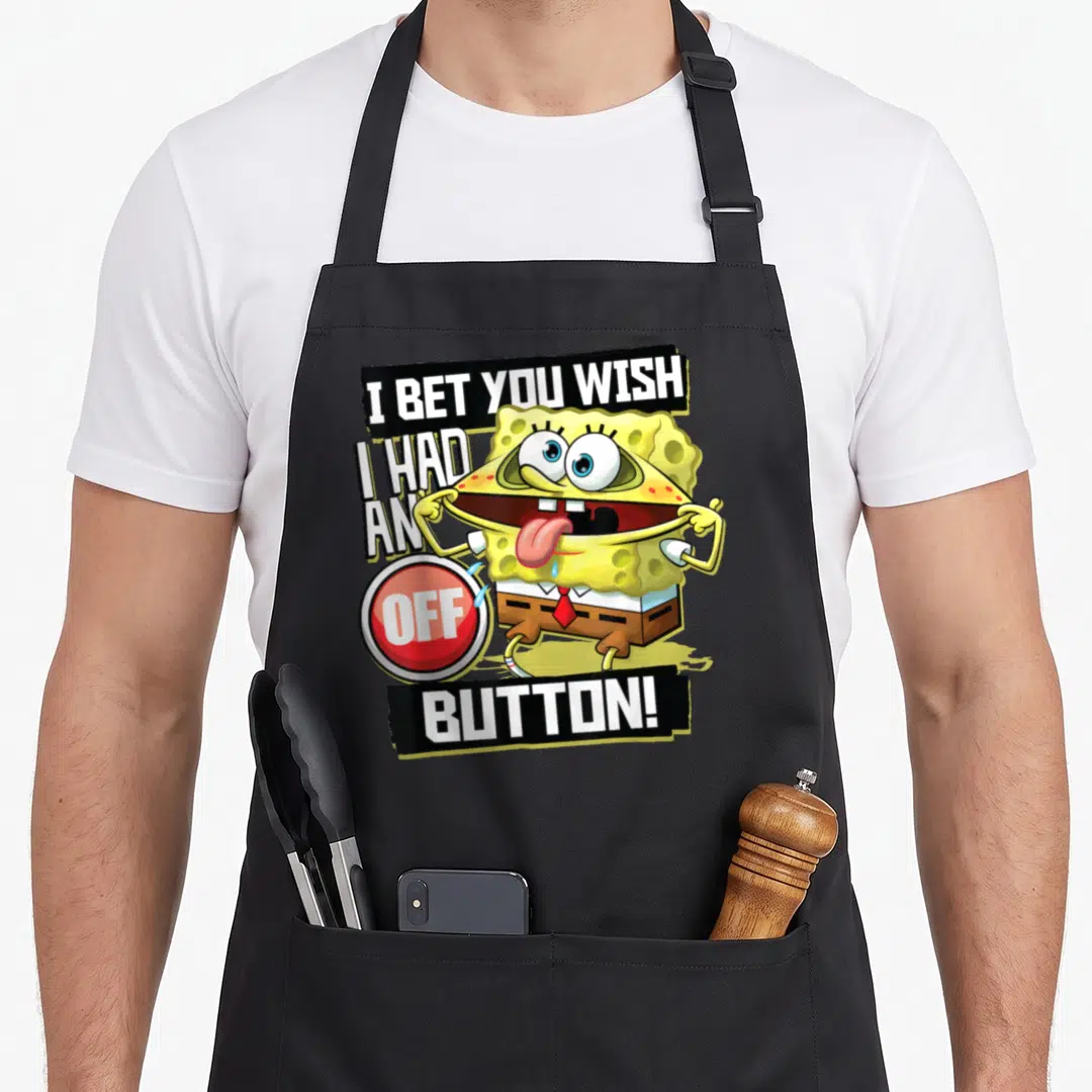Squarepant novelty apron - SpongeBob pulling skin to reveal red OFF button with surrounding text — shown on a black cotton canvas apron against a white background