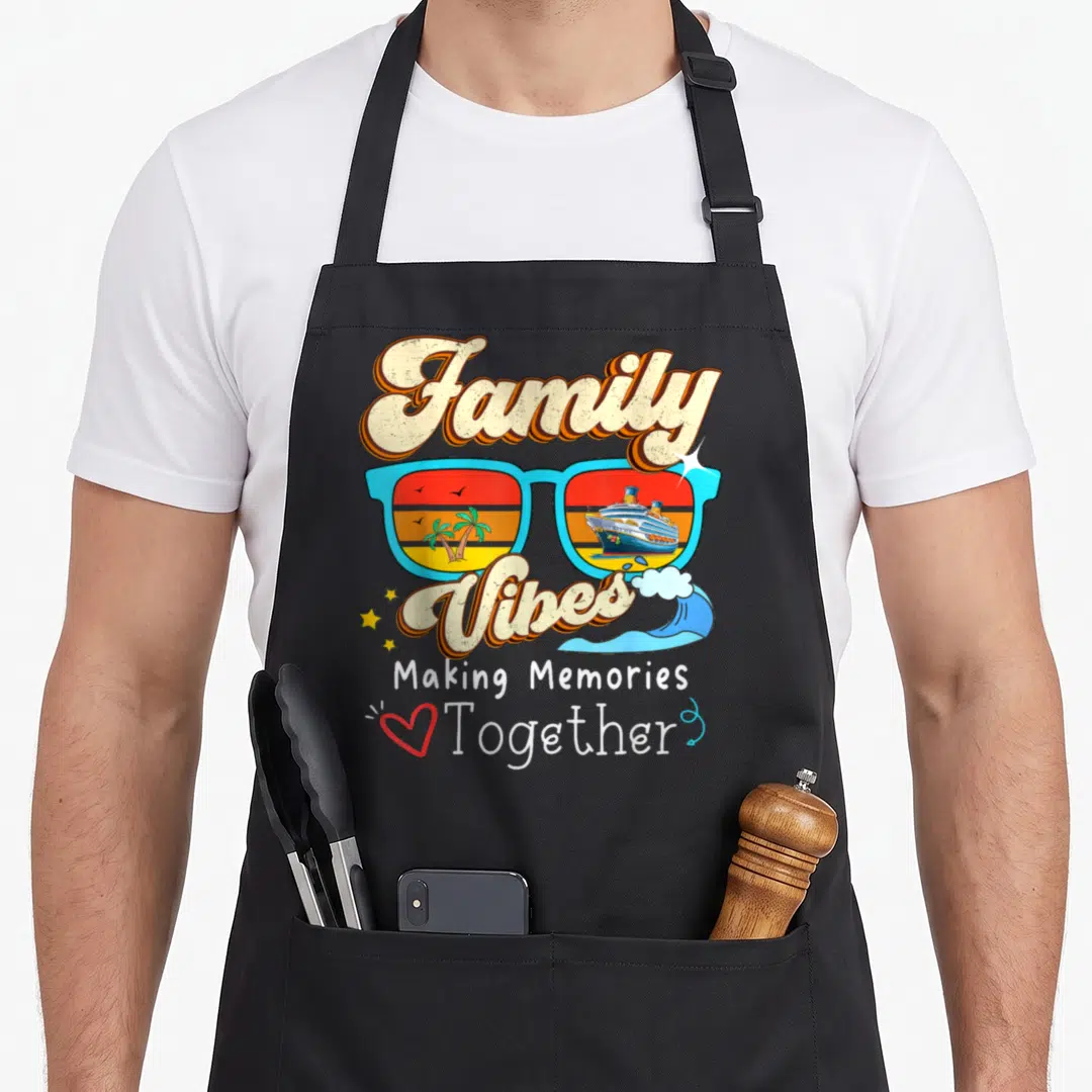 Making together memory apron - Retro sunglasses with ship and palm tree scenes surrounded by Family Vibes text — shown on a black cotton canvas apron against a white background