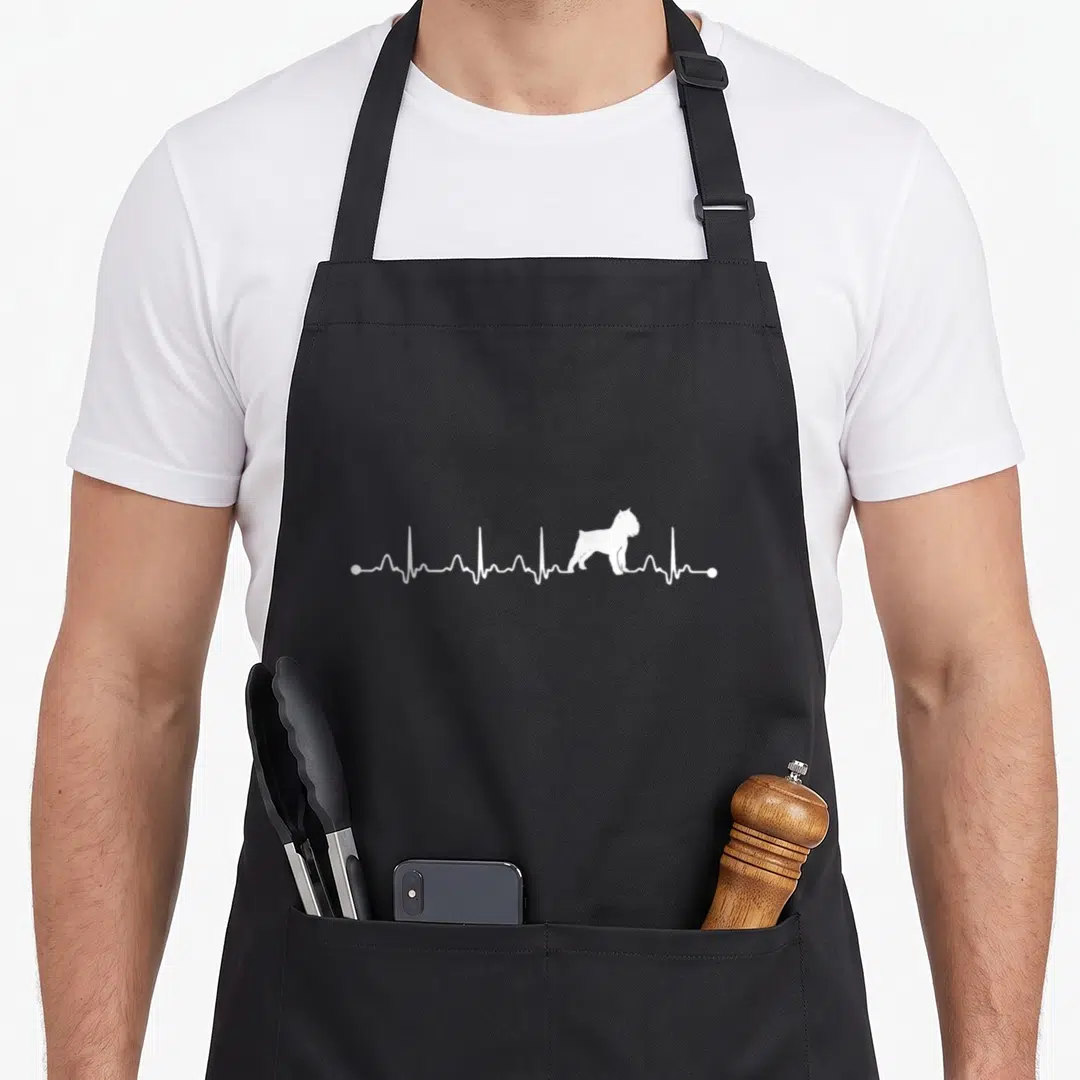 Eternity dog apron - White EKG heartbeat line containing a standing Brussels Griffon dog silhouette — shown on a black cotton canvas apron against a white background