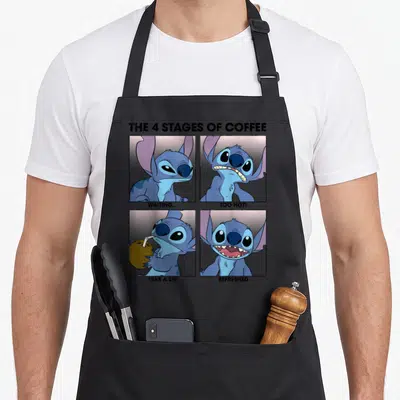 Stage coffee apron - Stitch cartoon in 4 panels with captions Waiting Too Hot Take A Sip Refreshed — shown on a black cotton canvas apron against a white background