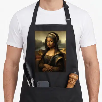 Mona lisa african american aprons - Realistic woman in headwrap and gold jewelry against hazy mountains and water — shown on a black cotton canvas apron against a white background