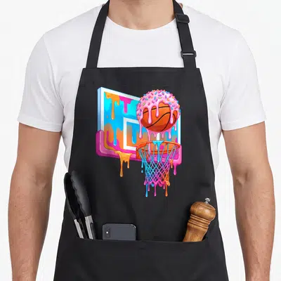 Sport ice cream apron - Cartoon basketball donut with pink frosting and sprinkles dripping over a blue and orange hoop — shown on a black cotton canvas apron against a white background