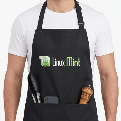 Mint open apron - Stylized lm logo next to linux Mint text in green and white — shown on a black cotton canvas apron against a white background