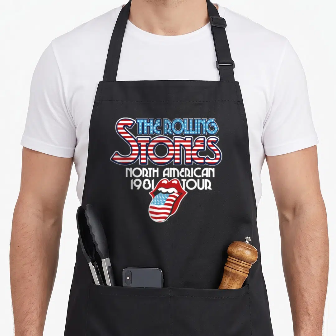 Vintage tour rolling stones apron - Red white and blue flag patterned letters reading The Rolling Stones North American — shown on a black cotton canvas apron against a white background