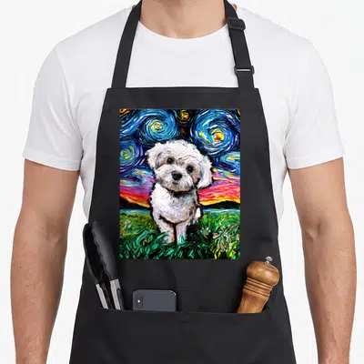 Maltipoo dog apron - White dog in watercolor style with swirling blue yellow sky and green grass — shown on a black cotton canvas apron against a white background
