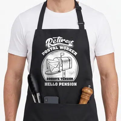 Retired mail postal aprons - Retro mailbox illustration with Retired Postal Worker text and pension pun in black — shown on a black cotton canvas apron against a white background