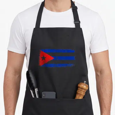Cuba travel pride apron - Distressed Cuban flag with blue white red stripes and star — shown on a black cotton canvas apron against a white background