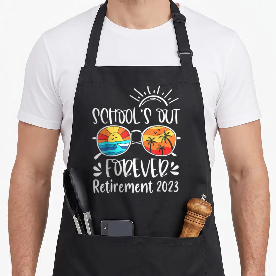 Forever retired teachers apron - Sunglasses with beach scenes and School's Out Forever Retirement 2023 text — shown on a black cotton canvas apron against a white background