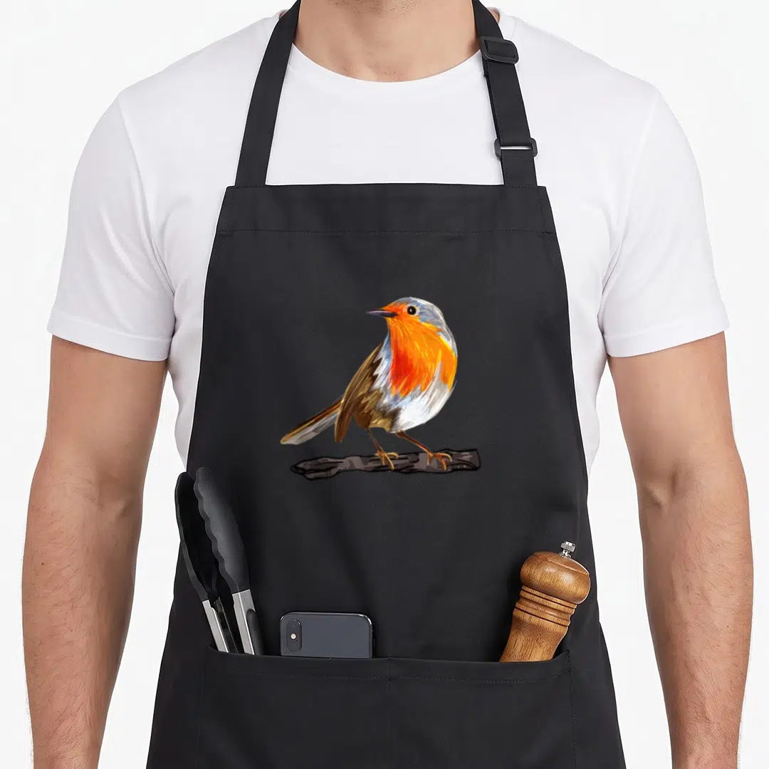 Funny robin bird apron - Realistic bird perched on branch in orange grey and brown plumage — shown on a black cotton canvas apron against a white background