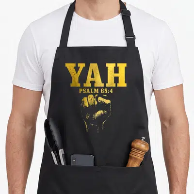 Psalm jewish apron - Yellow distressed YAH PSALM 68:4 text above a clenched fist graphic — shown on a black cotton canvas apron against a white background