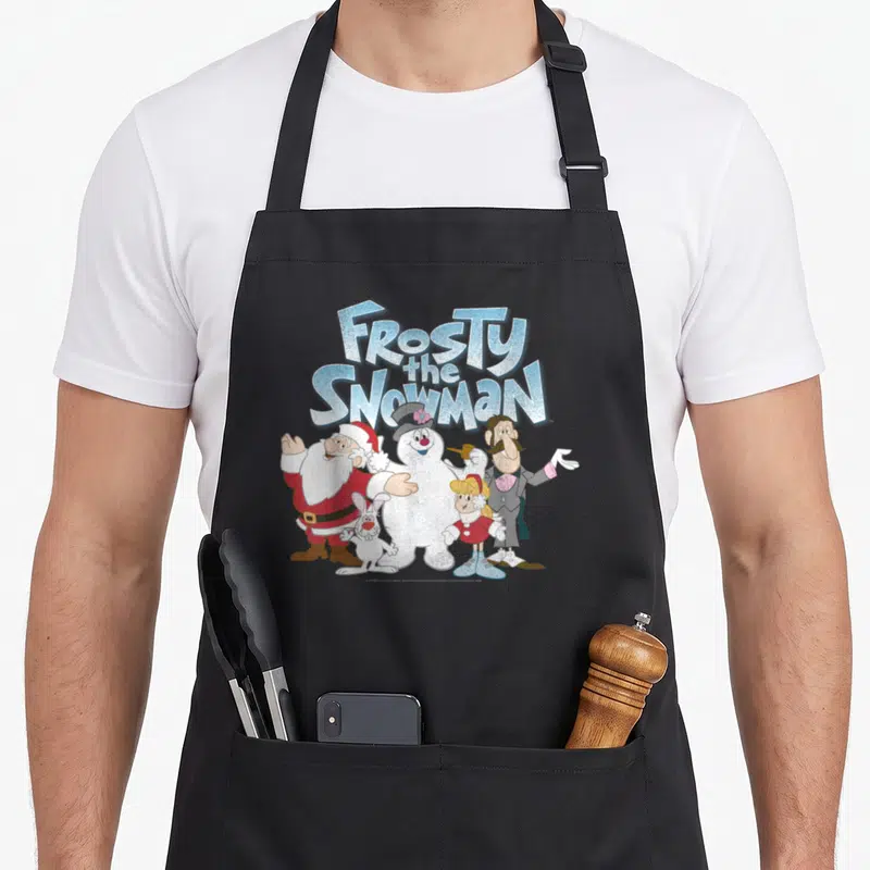 Shot snowman apron - Frosty the Snowman text above Santa, man, girl, and rabbit in cartoon style — shown on a black cotton canvas apron against a white background