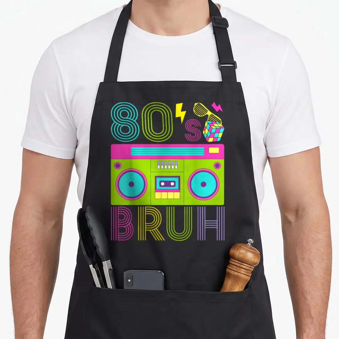 Cool costume 80s apron - Neon boombox with 80S BRUH text, lightning bolts, sunglasses, and cube — shown on a black cotton canvas apron against a white background