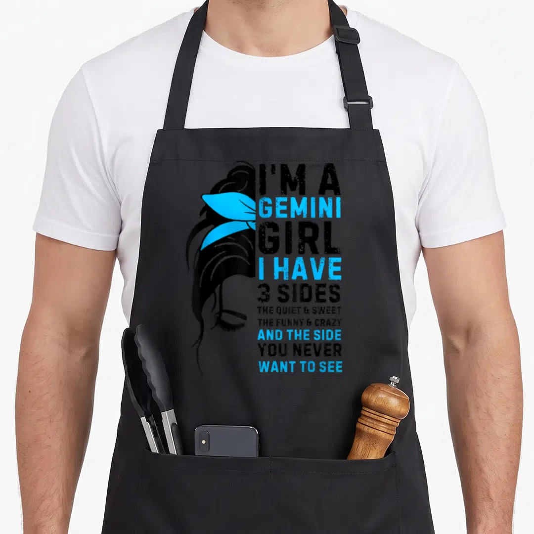 June zodiac birthday apron - Profile of woman with blue wings and text listing three personality sides in black and blue — shown on a black cotton canvas apron against a white background