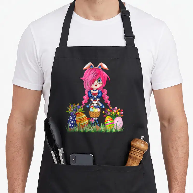 Ear bunny apron - Pink hair anime girl with bunny ears holding egg basket between large decorated eggs and flowers — shown on a black cotton canvas apron against a white background