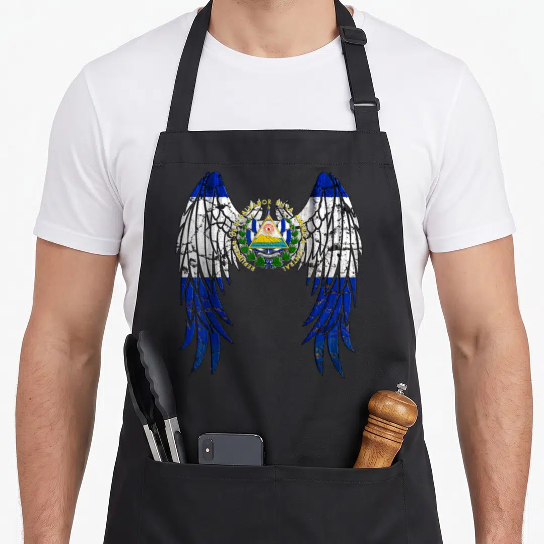 Angel el cook apron - Coat of arms with REPUBLICA DEL SALVADOR EN AMERICA CENTRAL text between two striped angel wings — shown on a black cotton canvas apron against a white background