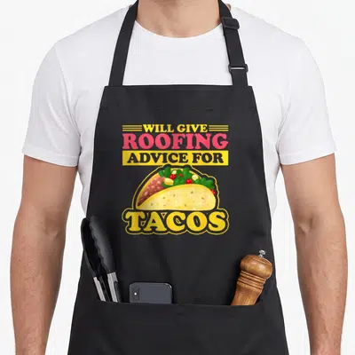 Give roofing apron - Stacked text Will Give Roofing Advice For Tacos above cartoon taco illustration — shown on a black cotton canvas apron against a white background