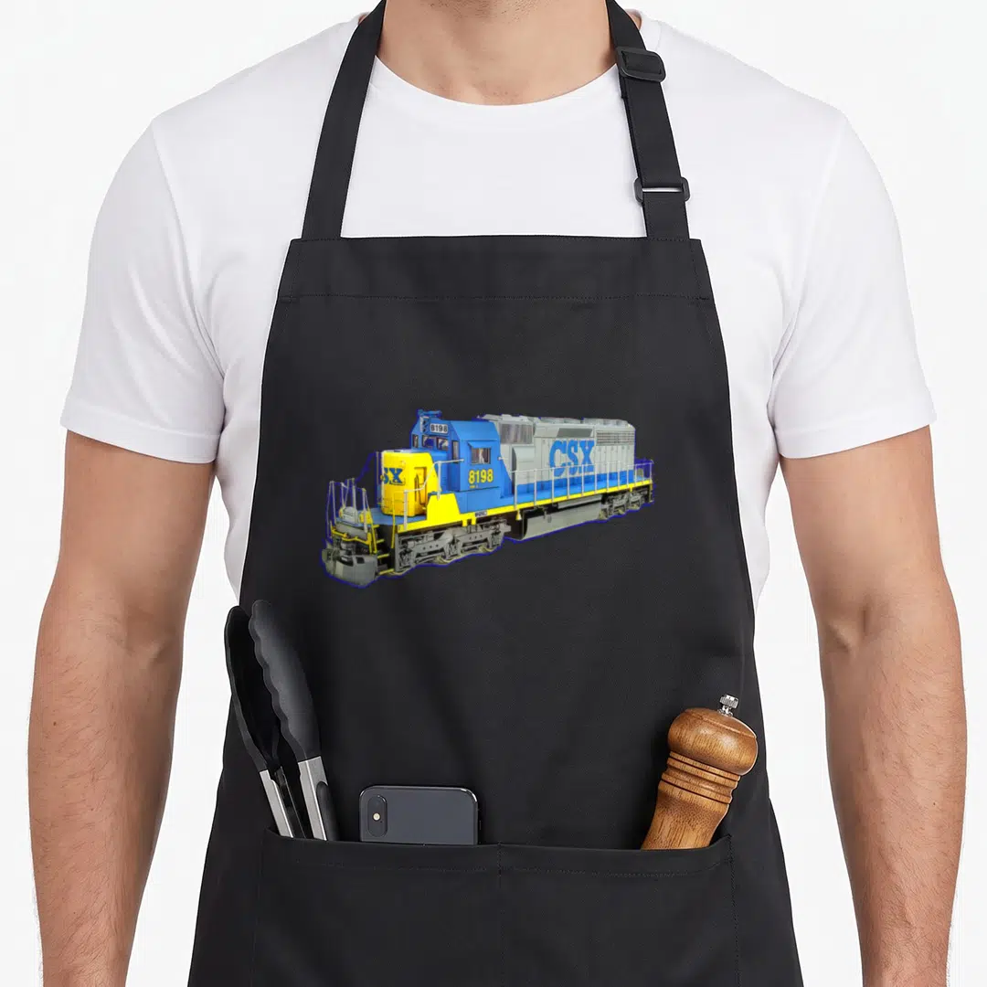 Freight train engine apron - Realistic blue yellow grey CSX locomotive 8198 print — shown on a black cotton canvas apron against a white background