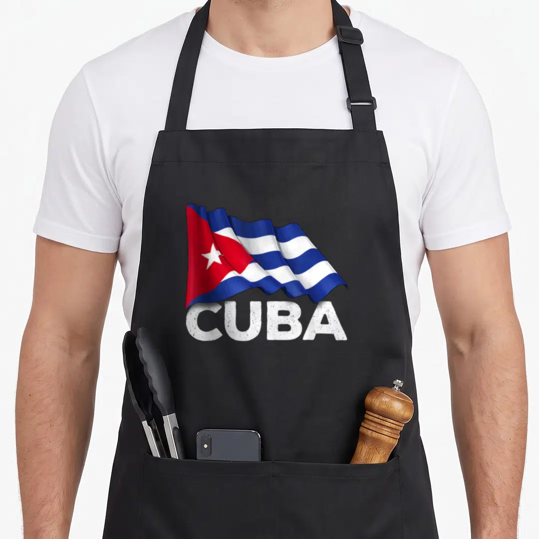 Cuba country apron - Waving Cuban flag in blue white and red above bold CUBA text — shown on a black cotton canvas apron against a white background