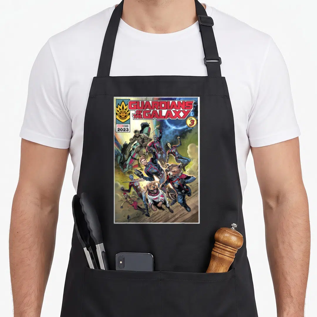 Guardian cosmo apron - Guardians of the Galaxy Vol 3 characters leaping forward in comic book style — shown on a black cotton canvas apron against a white background