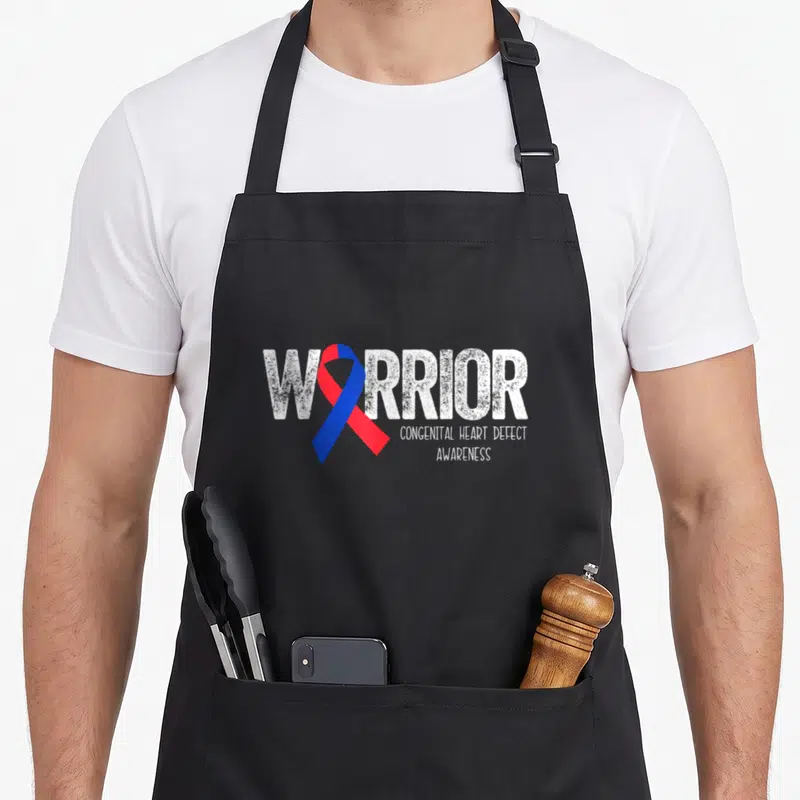 Month congenital heart defect apron - Distressed white warrior text with red and blue awareness ribbon on black apron — shown on a black cotton canvas apron against a white background