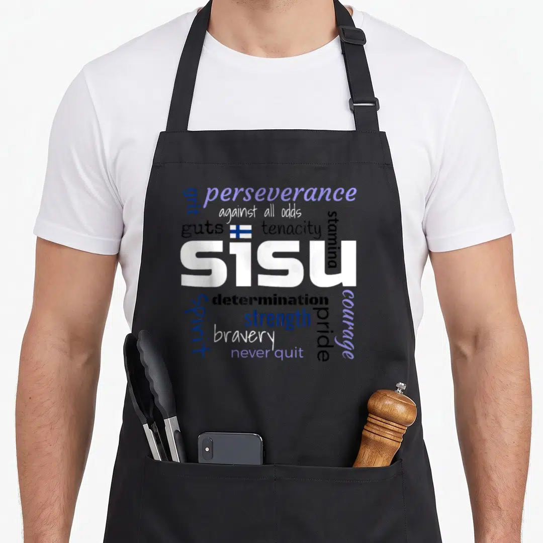 Definition finnish apron - SISU typography collage with Finnish flag and words grit perseverance tenacity — shown on a black cotton canvas apron against a white background