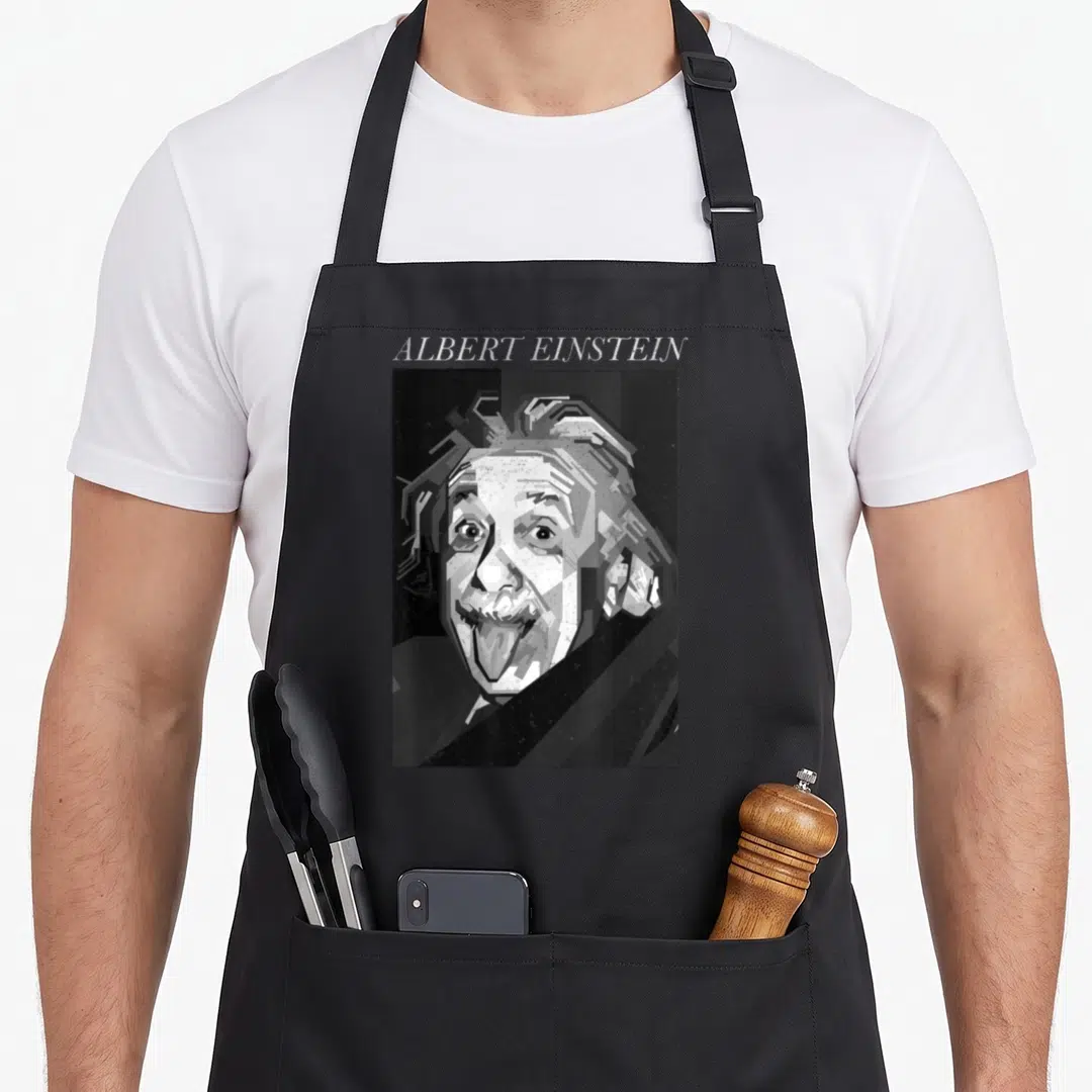 Albert trendy apron - Pixel art portrait of Albert Einstein sticking tongue out with name printed above in grayscale — shown on a black cotton canvas apron against a white background