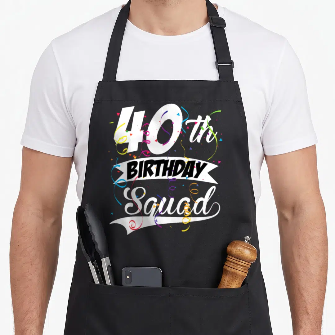Squad forty 40th birthday apron - Vertical 40th Birthday Squad text with colorful confetti and streamers on white — shown on a black cotton canvas apron against a white background
