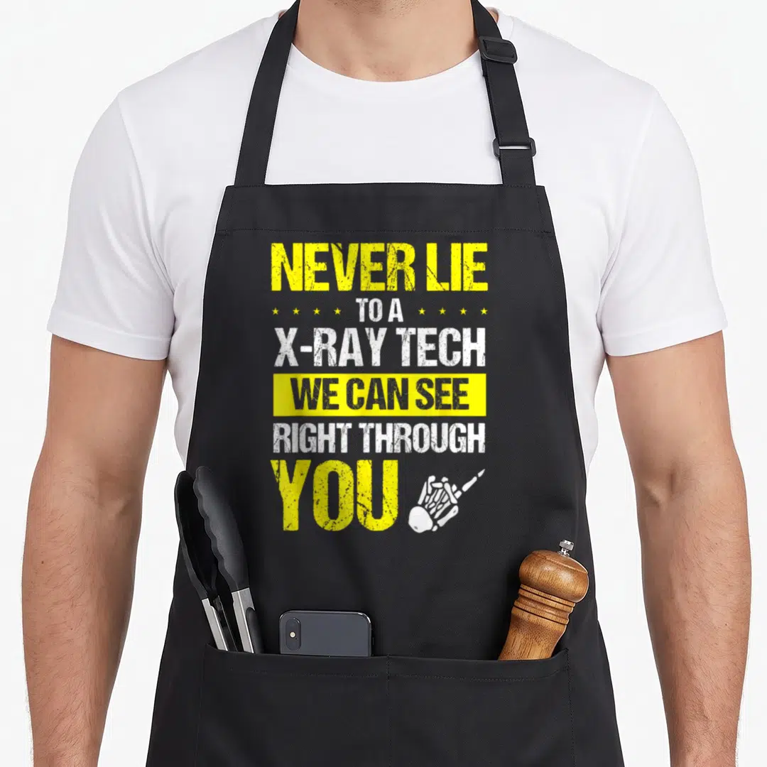 Xray skeleton apron - Stacked yellow and white text NEVER LIE X-RAY TECH with white skeleton hand pointing right — shown on a black cotton canvas apron against a white background