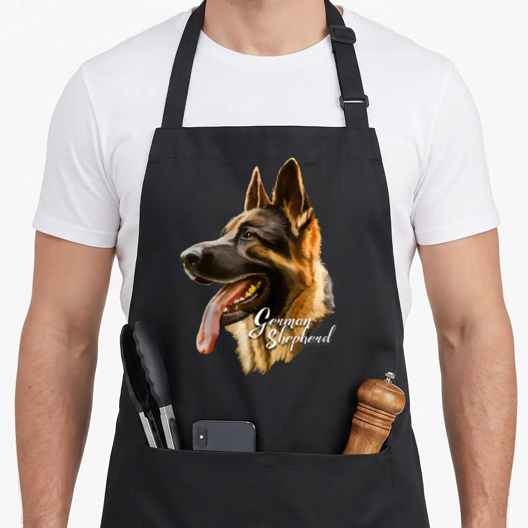 Shepherd dog mom apron - Realistic German Shepherd head profile with open mouth and white script text overlapping — shown on a black cotton canvas apron against a white background