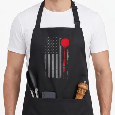 Throw american flag apron - Red dart vertically positioned over faded grey USA flag pattern — shown on a black cotton canvas apron against a white background