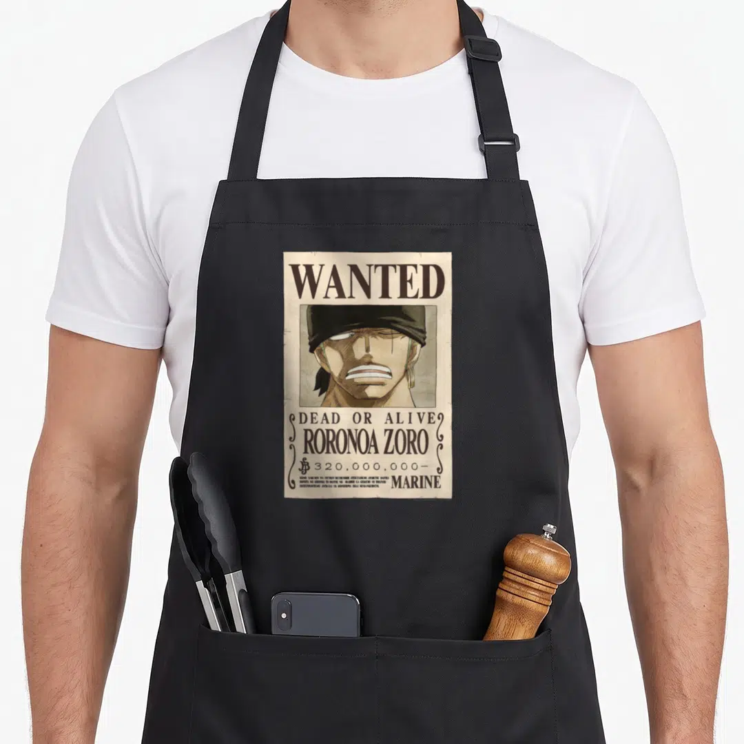 Zoro anime apron - Roronoa Zoro wanted poster with 320 million bounty and Japanese text on beige background — shown on a black cotton canvas apron against a white background