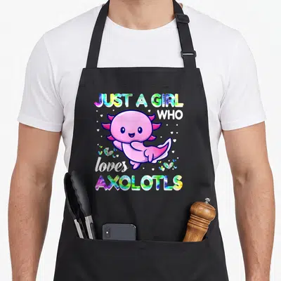 Retro axolotl kawaii apron - Pink axolotl with galaxy text JUST A GIRL WHO loves AXOLOTLS and scattered hearts — shown on a black cotton canvas apron against a white background