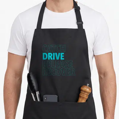 Catch rowing apron - Teal text reading Catch Drive Release Recover stacked vertically — shown on a black cotton canvas apron against a white background