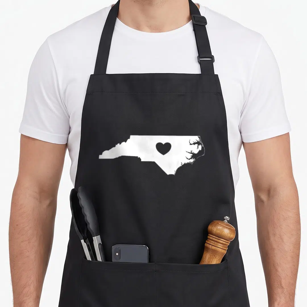 State north carolina apron - White North Carolina map silhouette with a grey heart centered inside on a grey background — shown on a black cotton canvas apron against a white background