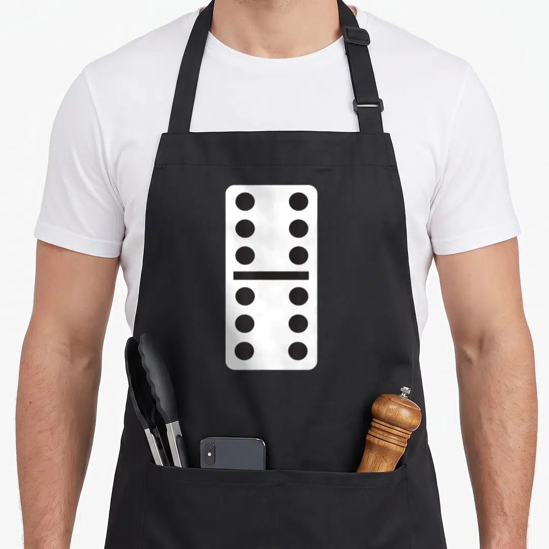 Double halloween apron - White domino tile with six black dots on top and bottom halves separated by a line — shown on a black cotton canvas apron against a white background